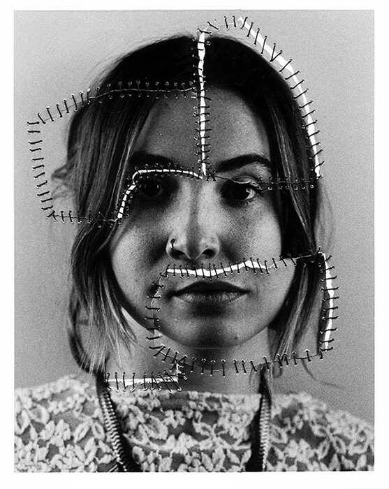 Black and white photograph that was torn apart and then stitched back together in places.